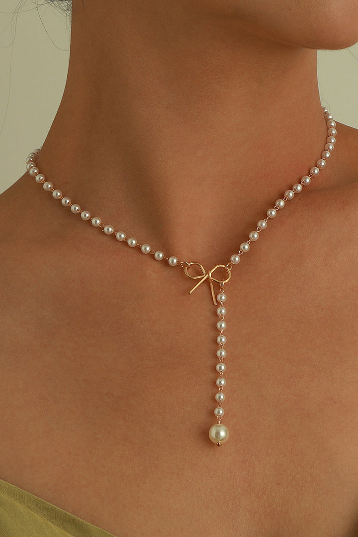 Collier en chaîne de perles avec nœud plaqué