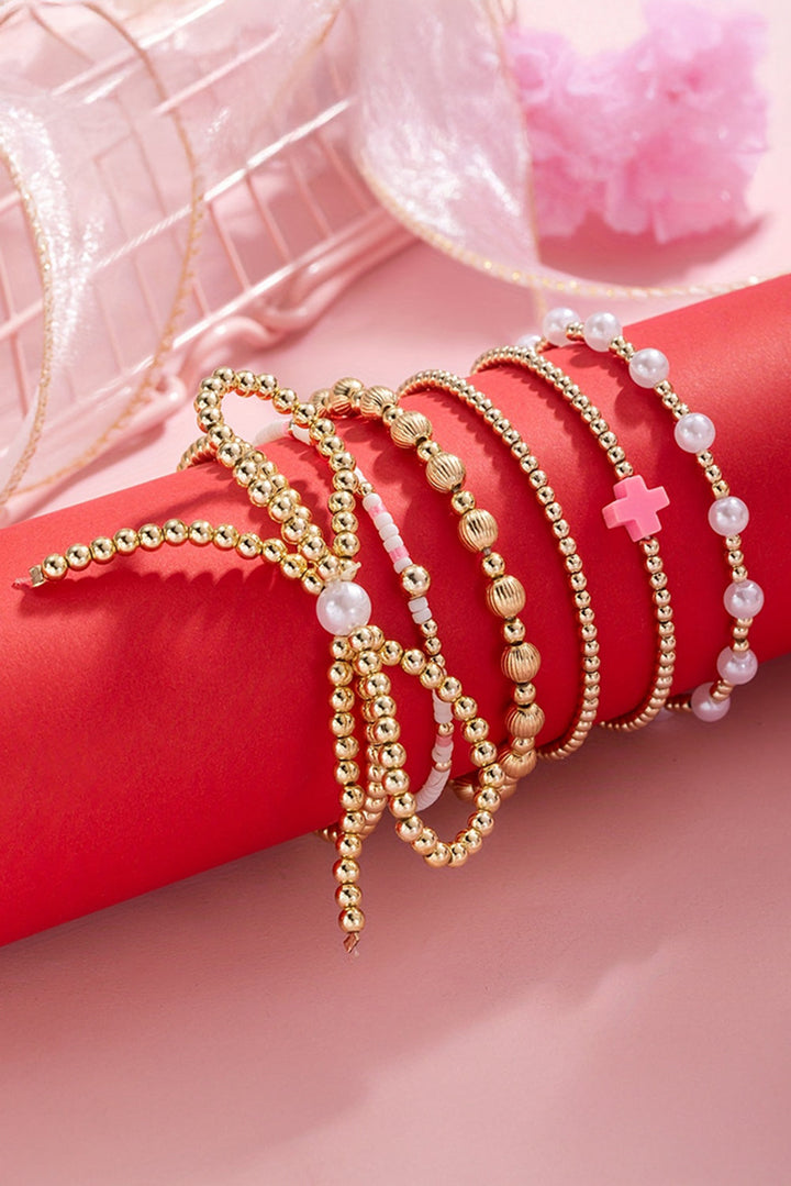 Bracelet multicouche plaqué orné de perles et de nœuds papillon