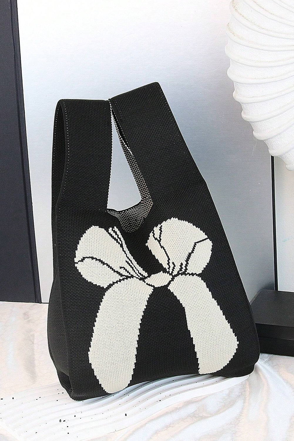 Sac à main tricoté à motif nœud papillon colorblock