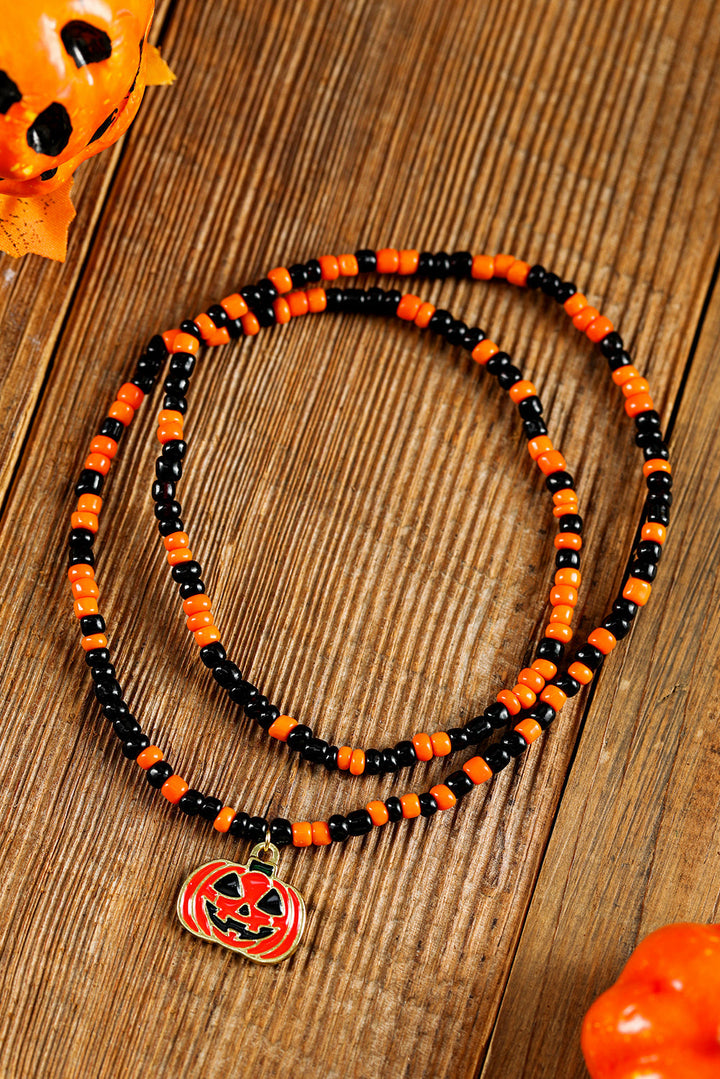 Collier d'Halloween avec pendentif en forme de visage de citrouille et perles de riz