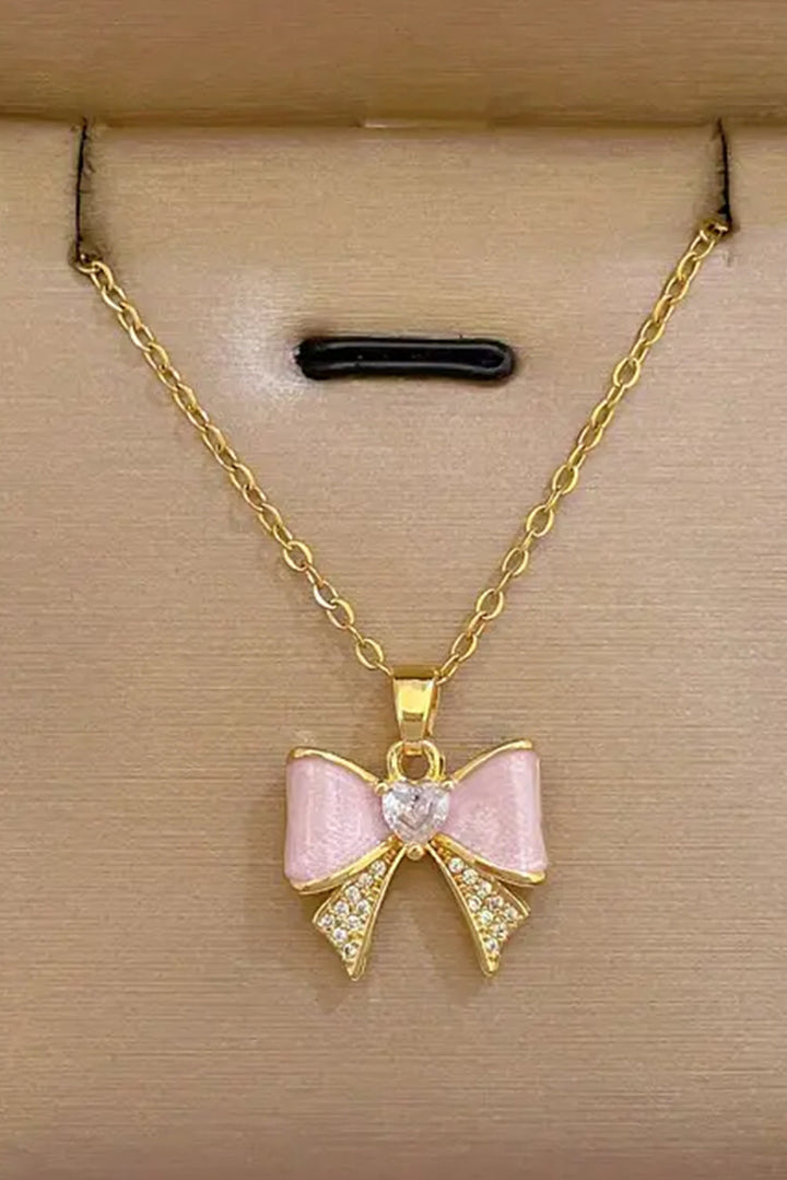 Collier ras du cou plaqué strass avec nœud papillon