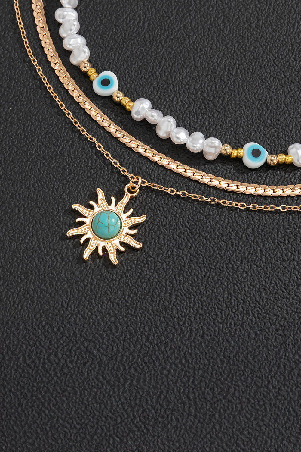 Collier pendentif multicouche en perles turquoises et perles de soleil