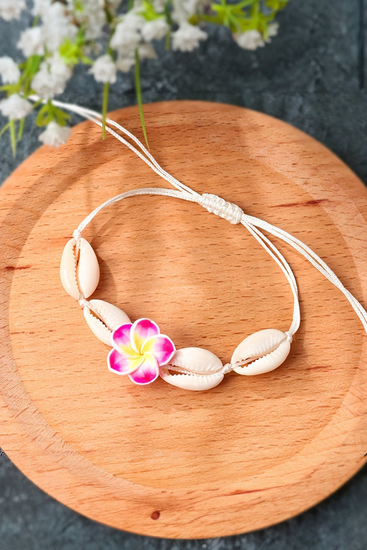 Bracelet ajustable en coquillage et fleurs