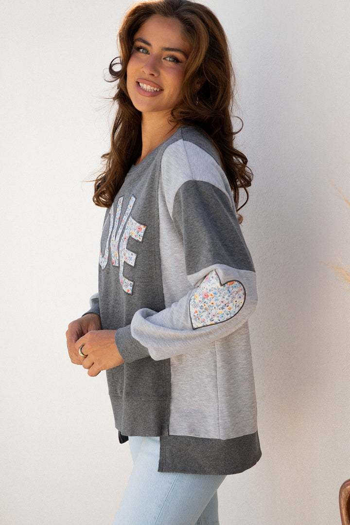 LOVE Graphic Exposed Seam Patchwork Uneven Hem Chic Sweatshirt
