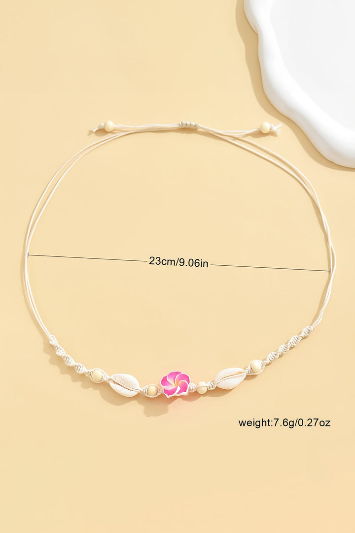 Collier ras du cou tressé en coquillage et fleurs