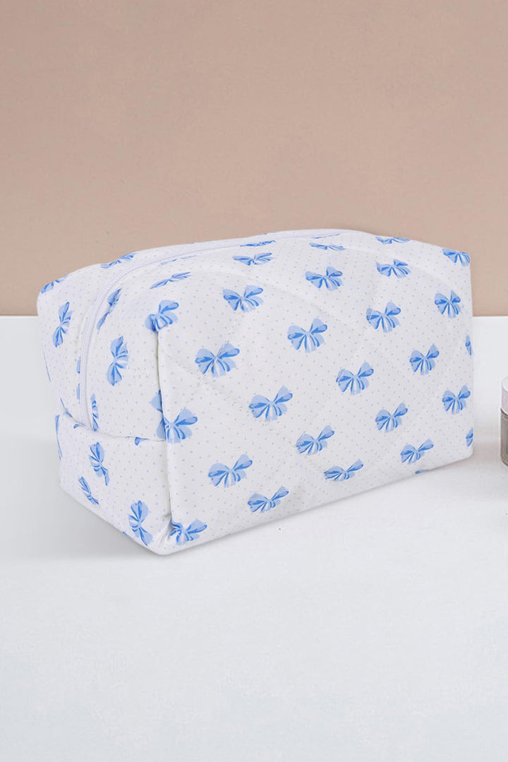 Trousse de maquillage matelassée à fermeture éclair et nœud papillon