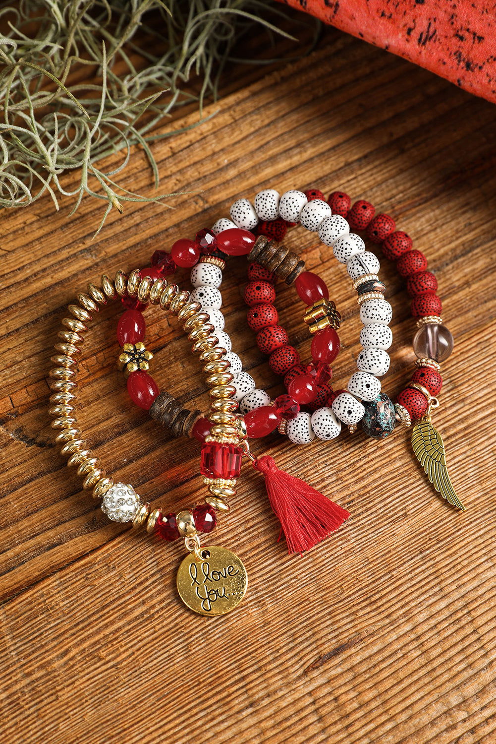 Ensemble de 4 bracelets bohèmes avec pendentifs en forme d'ailes et de disques
