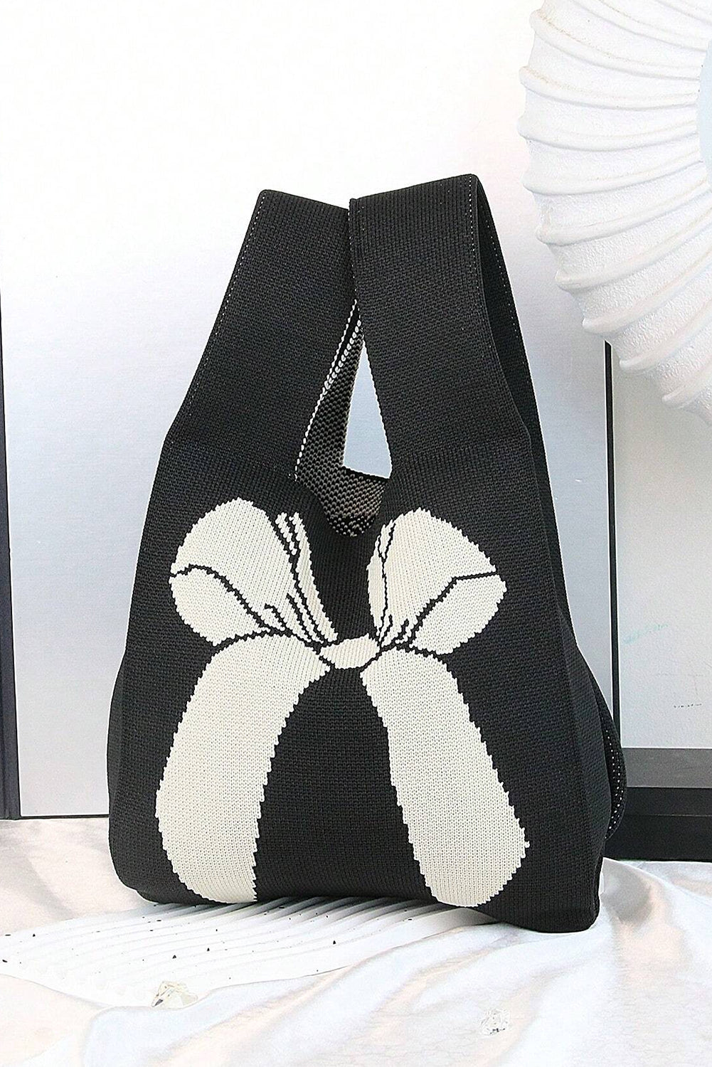 Sac à main tricoté à motif nœud papillon colorblock