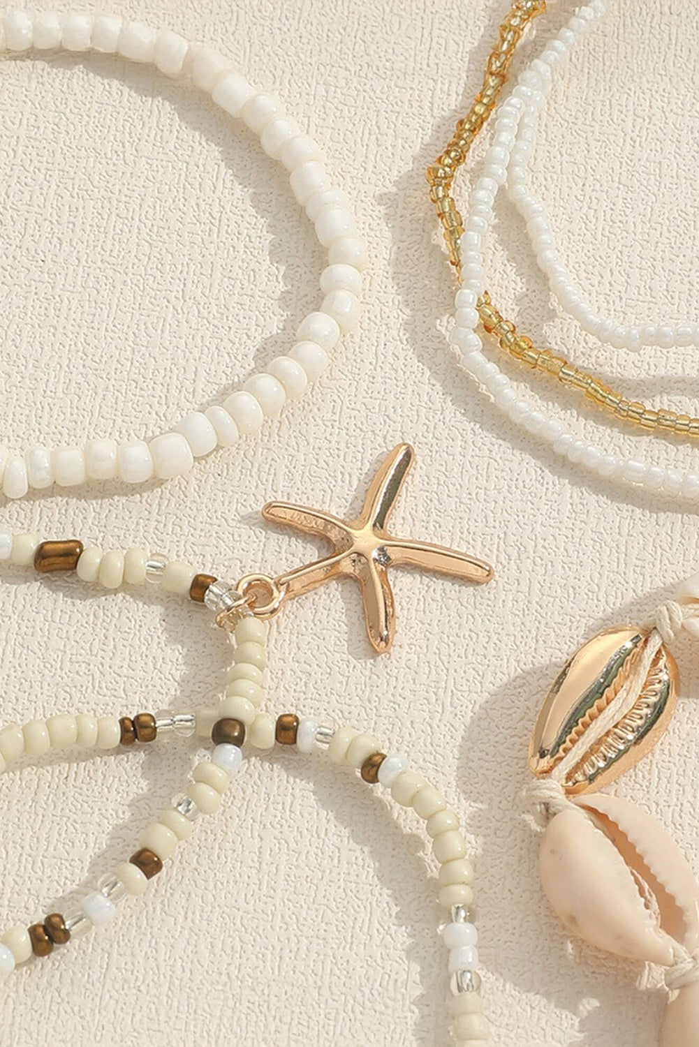 Ensemble de bracelets multicouches en perles avec décor de coquillages et d'étoiles de mer