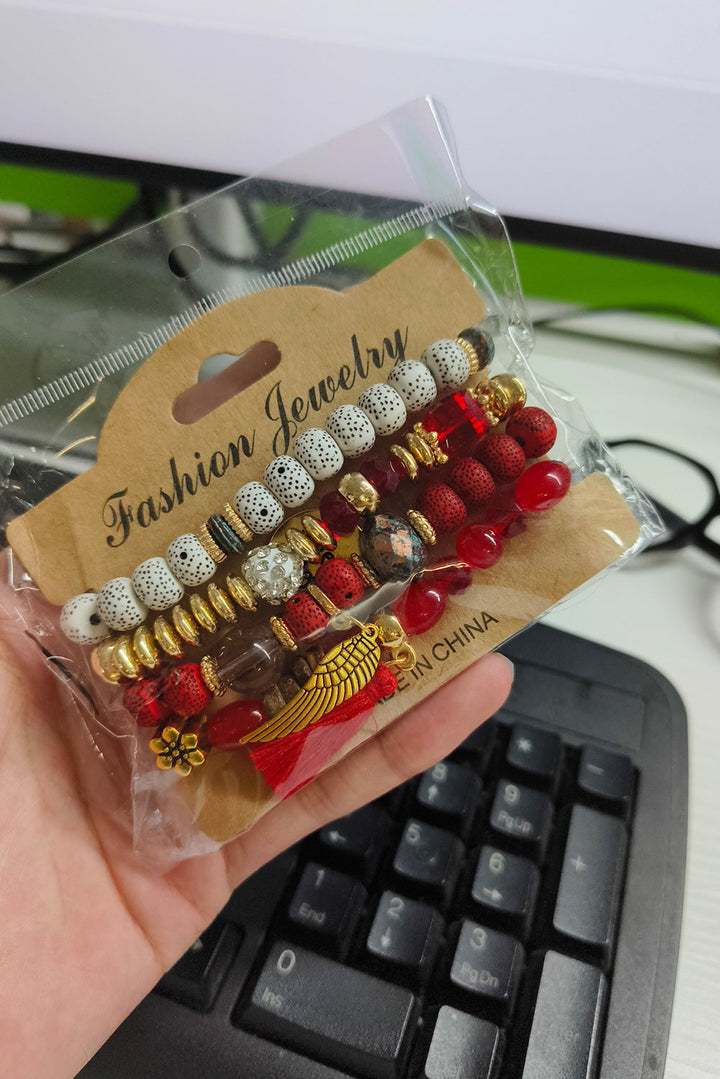 Ensemble de 4 bracelets bohèmes avec pendentifs en forme d'ailes et de disques